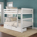 White wooden bunk bed with built-in storage drawers, ladder and beige bedding against a teal wall in a coastal-style bedroom