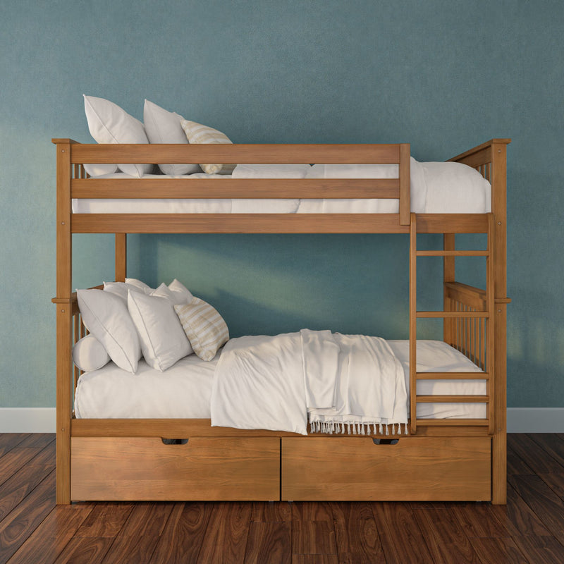 Wooden bunk bed with ladder and under-bed storage drawers, linens and pillows against teal wall in kids' bedroom
