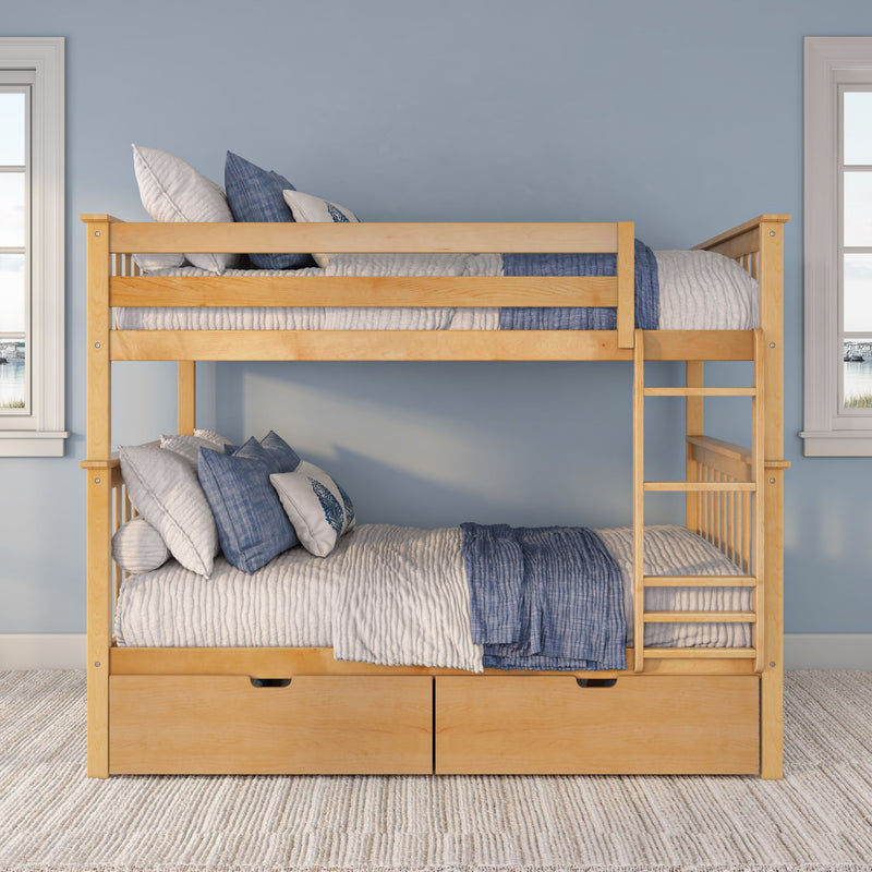 Light wood bunk bed with ladder and built-in storage drawers, dressed in blue-and-white quilted bedding and pillows in a bright coastal kids' bedroom