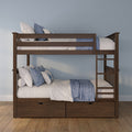 Solid dark wood bunk bed with ladder and built‑in under‑bed storage drawers, styled with blue and white quilted bedding and pillows against a light blue bedroom wall
