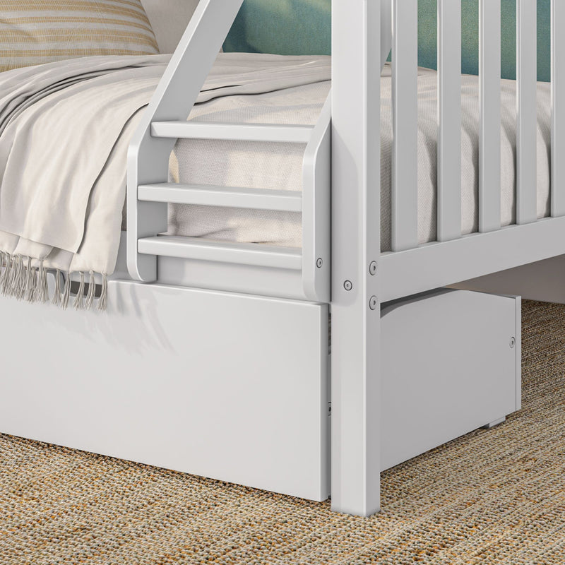 White wooden bunk bed ladder and safety rail with neutral linen bedding and built-in drawer on woven jute rug