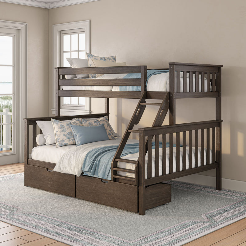 Dark wood twin-over-full bunk bed with ladder and under-bed storage drawers, blue and white coastal bedding and floral pillows in a bright bedroom