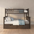 Dark wood bunk bed with ladder and under-bed storage drawers, white and blue bedding and floral pillows in a neutral modern bedroom