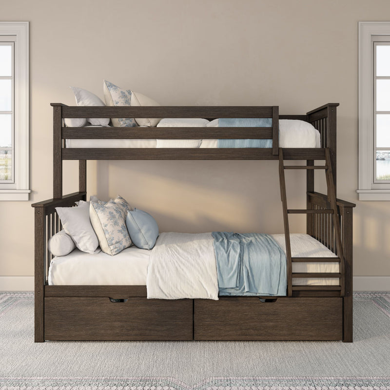 Dark wood twin-over-full bunk bed with ladder and under-bed storage drawers, styled with white and blue linens and floral pillows in a bright neutral bedroom with windows