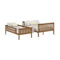 Honey oak twin daybeds with slatted headboard and footboard, white linen bedding and beige striped accent pillows, modern farmhouse style