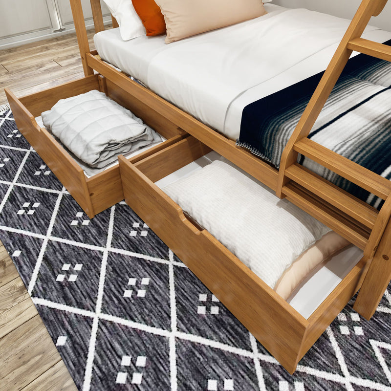 Wooden bunk bed with storage drawers, featuring white and striped bedding, on a geometric patterned rug in a modern bedroom.