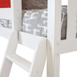 White wooden bunk bed with ladder and giraffe-themed bedding.