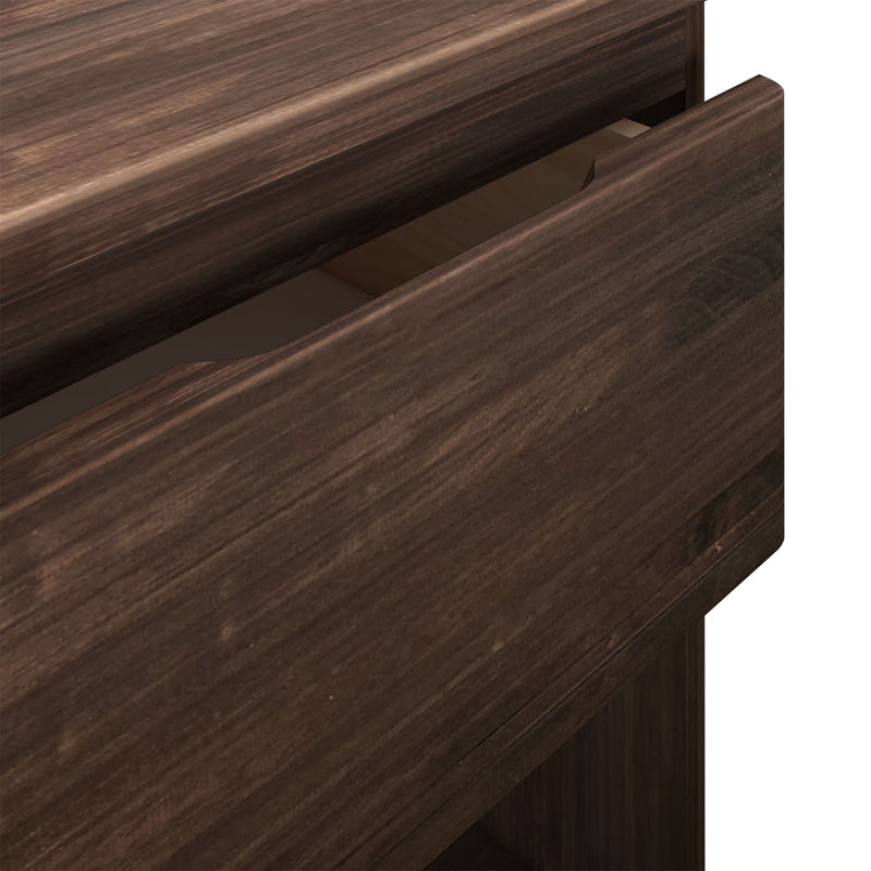 Open dark wood dresser drawer showing detail of wooden texture and craftsmanship.