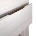 Close-up of a partially open wooden dresser drawer showing light wood grain texture.