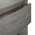Gray wooden open drawer showcasing storage space in a modern furniture design.