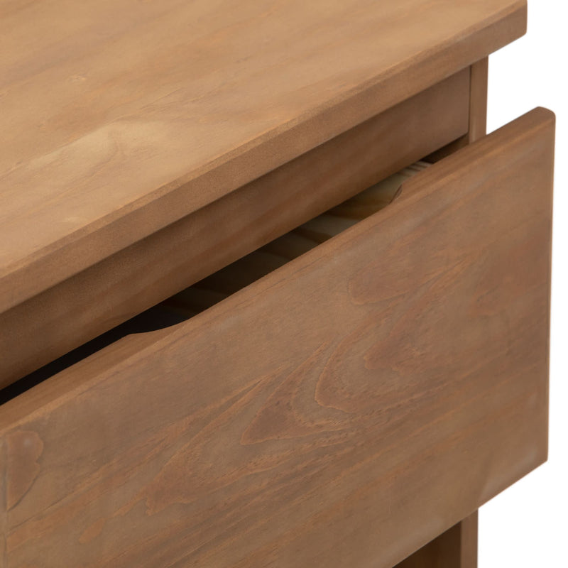 Wooden dresser close-up with open drawer showing natural grain texture.