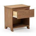 Wooden bedside table with open drawer, featuring a minimalist design and ample storage space.