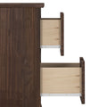 Side view of walnut wood dresser with two partially open light-wood drawers and visible metal drawer slides, modern bedroom storage furniture