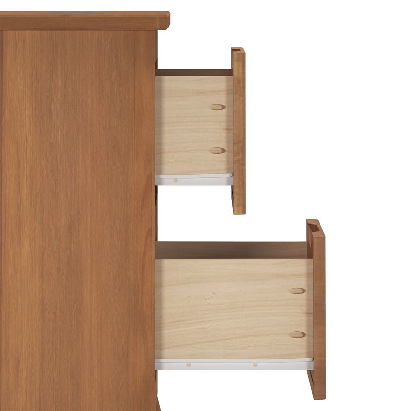 Close-up side view of a natural oak wooden dresser with two partially open drawers showing wood grain and metal drawer slides