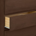 Open brown wooden dresser drawer showing interior storage space.