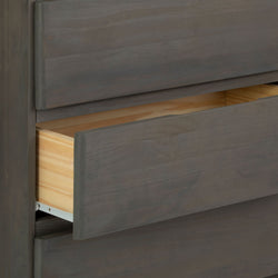 Wooden dresser with partially opened drawer in modern design.