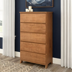 Tall 5-drawer wooden dresser in natural oak finish for bedroom storage, modern farmhouse chest of drawers against a navy accent wall with white curtains, decorative candles and patterned area rug