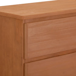 Close-up view of a wooden dresser with a smooth finish and modern design.