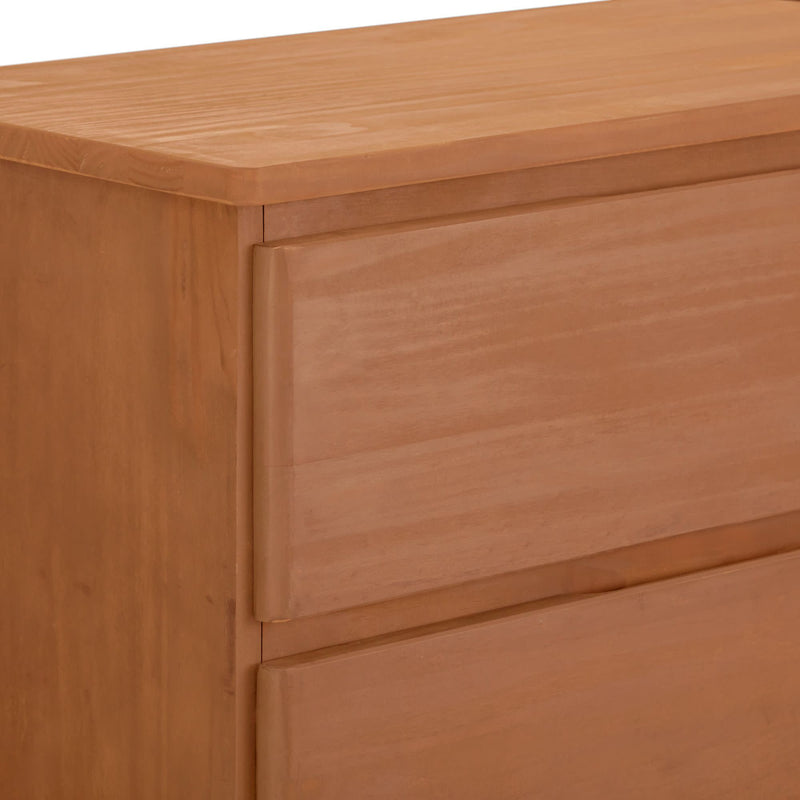 Close-up view of a wooden dresser with a smooth finish and modern design.