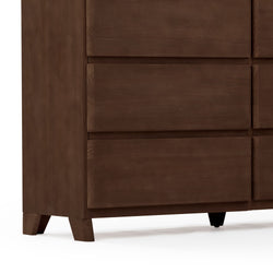 Dark brown wooden dresser with three wide drawers and tapered legs, mid-century modern bedroom storage chest