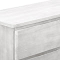 Whitewashed wood dresser close-up showing drawer front, rounded edges and integrated handle — modern farmhouse bedroom storage