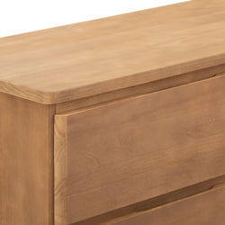 Natural wood dresser corner with smooth finish and minimalist design.