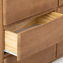 Wooden dresser with an open drawer, showcasing natural grain finish and interior space.