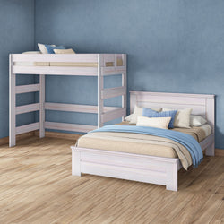 Light whitewashed wooden bunk bed and matching single bed with blue pillows and throw on hardwood floor against textured blue wall
