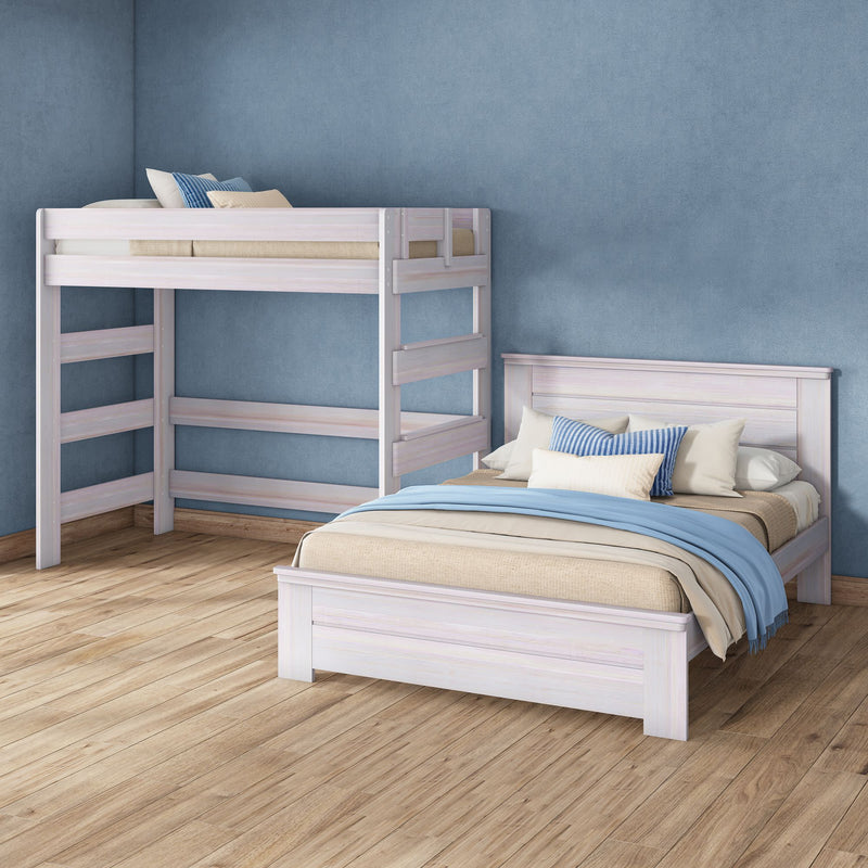 Light whitewashed wooden bunk bed and matching single bed with blue pillows and throw on hardwood floor against textured blue wall