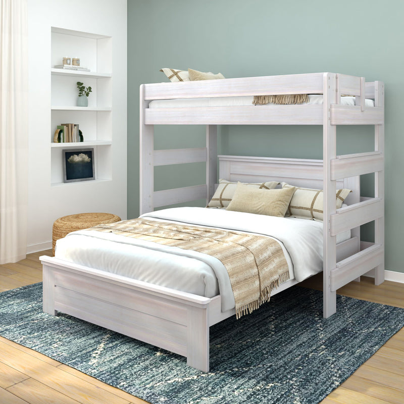 White wood bunk bed with full-size bed below, accented by beige and plaid pillows, positioned in a modern bedroom with a decorative shelf and natural lighting.
