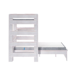 White wooden bunk bed with ladder and mattress, ideal for kids' bedrooms.