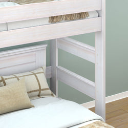 White wooden bunk bed with decorative pillows in a modern bedroom setting.