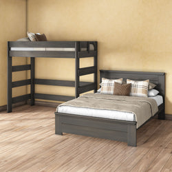 Gray wooden loft bunk bed and full-size bed in styled neutral farmhouse bedroom with plaid pillows, beige walls, and light hardwood floor