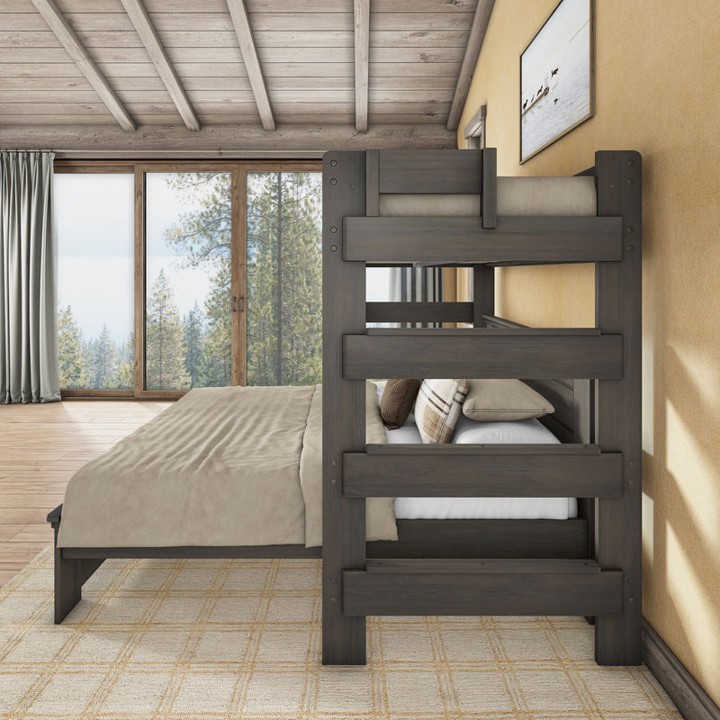 Cozy modern rustic cabin bedroom with dark wood bunk bed and king platform bed, beige linens, vaulted wood ceiling and large floor-to-ceiling window overlooking pine forest