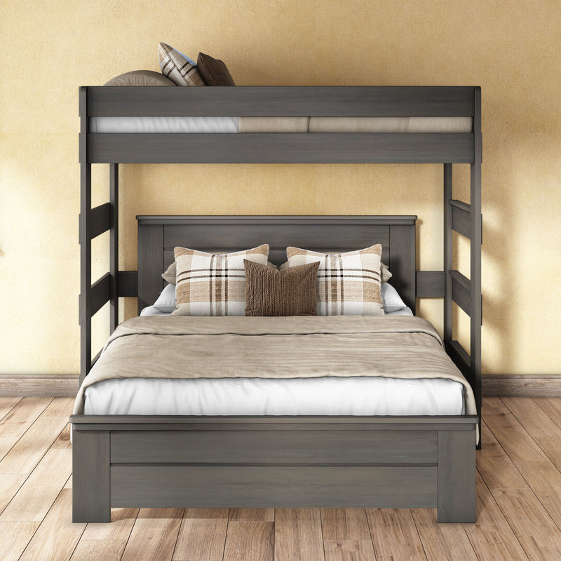 Gray solid-wood bunk bed with full-size lower bed and twin top bunk, neutral beige bedding and plaid accent pillows on wooden floor against a warm yellow wall