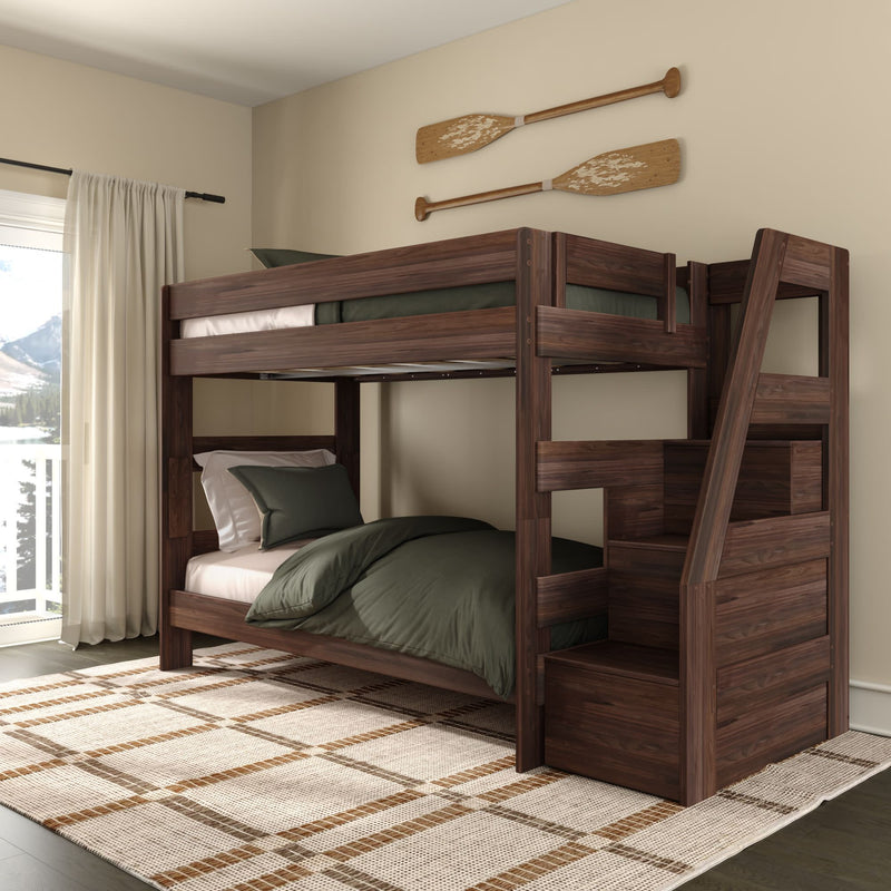 Dark walnut wooden bunk bed with built-in staircase storage and green bedding in cozy bedroom with mountain view and oar wall decor