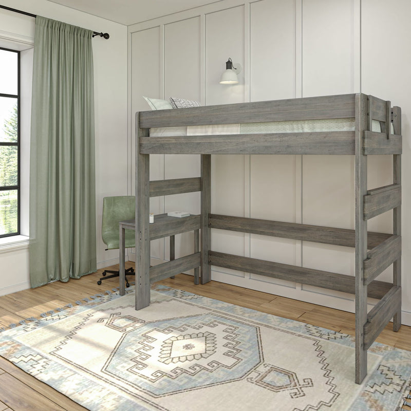 Loft bed with desk underneath in modern bedroom featuring light wood accents and a patterned rug.
