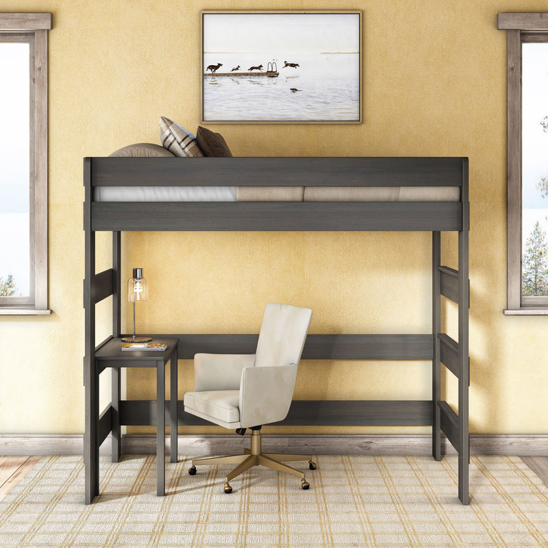 Modern gray wooden loft bed with built-in desk and white swivel chair in a compact bedroom office, yellow walls, area rug and framed coastal artwork