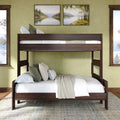 Modern dark wood bunk bed with white bedding and decorative pillows in a sunlit bedroom with green walls, landscape wall art and large windows