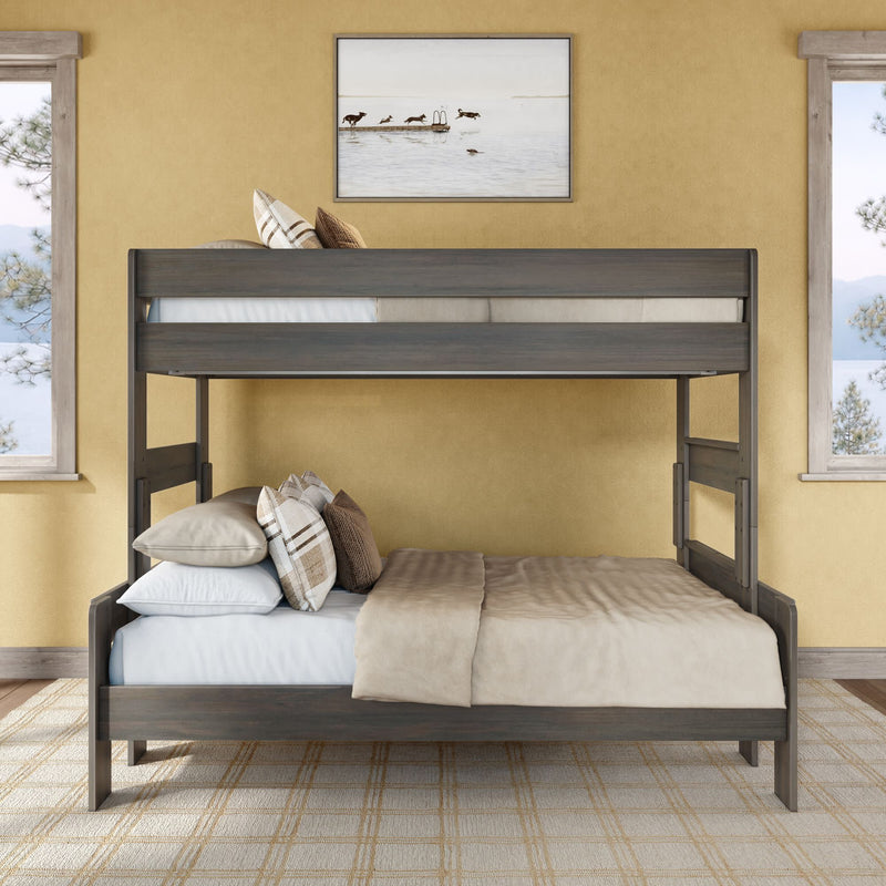 Gray wooden twin-over-full bunk bed in a cozy farmhouse bedroom with neutral bedding, plaid pillows, yellow walls, framed lake artwork and window views
