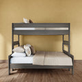 Gray wooden twin-over-full bunk bed with beige bedding and plaid pillows on hardwood floor against a yellow accent wall, modern space-saving design