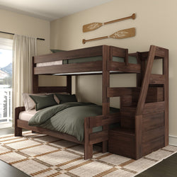 Solid dark-walnut space-saving bunk bed with built-in staircase storage, green bedding, rustic wooden paddle wall decor and a mountain-view window in a cozy bedroom