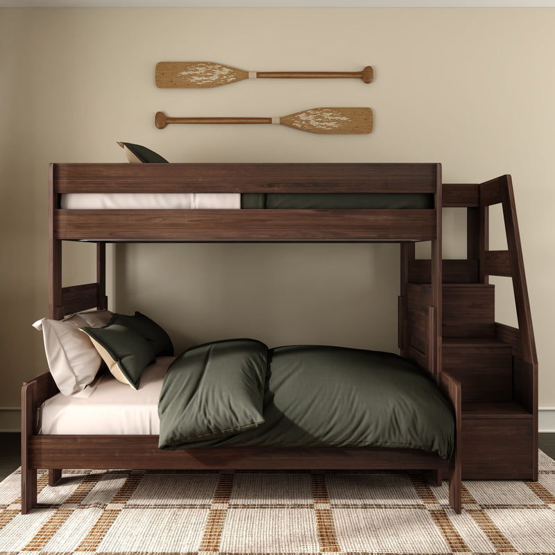 Dark wood bunk bed with built-in staircase and olive green bedding in a modern rustic bedroom featuring decorative wooden oars on a cream wall and woven area rug.
