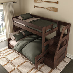 Dark walnut twin-over-full bunk bed with built-in staircase storage, green bedding and pillows, patterned area rug and coastal oar wall decor in a sunlit bedroom