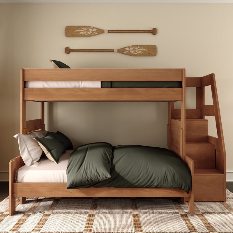 Solid wood bunk bed with built-in staircase, olive green bedding and decorative wooden oars on wall in neutral kids' bedroom