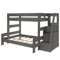 Gray wood twin-over-full bunk bed with built-in storage staircase, slatted platform lower bed frame and guardrails for kids' bedroom