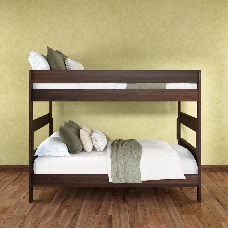 Modern dark wood two-tier bunk bed with green and white bedding against a yellow wall on hardwood floor — space-saving kids' bedroom furniture