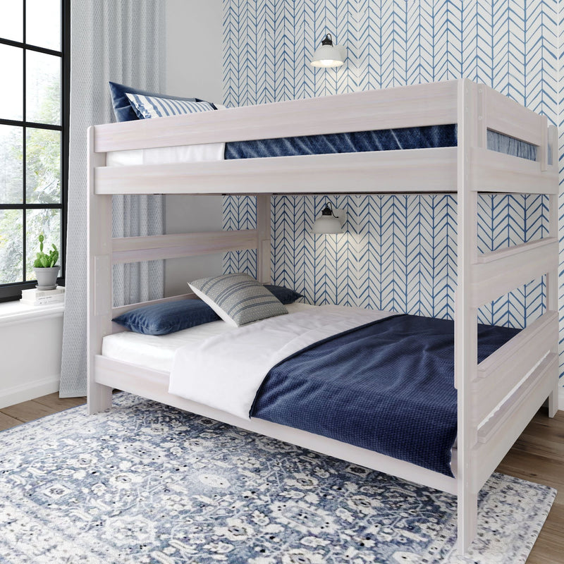 White bunk bed with blue bedding in a modern bedroom with patterned wallpaper and natural light.