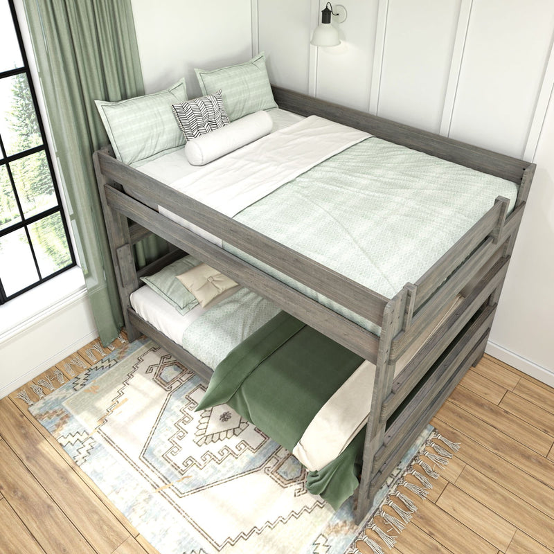 Wooden bunk bed with green bedding in a bright bedroom featuring hardwood floors and a patterned rug.