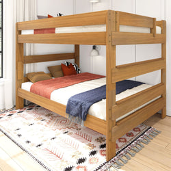 Wooden bunk bed with cozy bedding on patterned rug in modern bedroom.